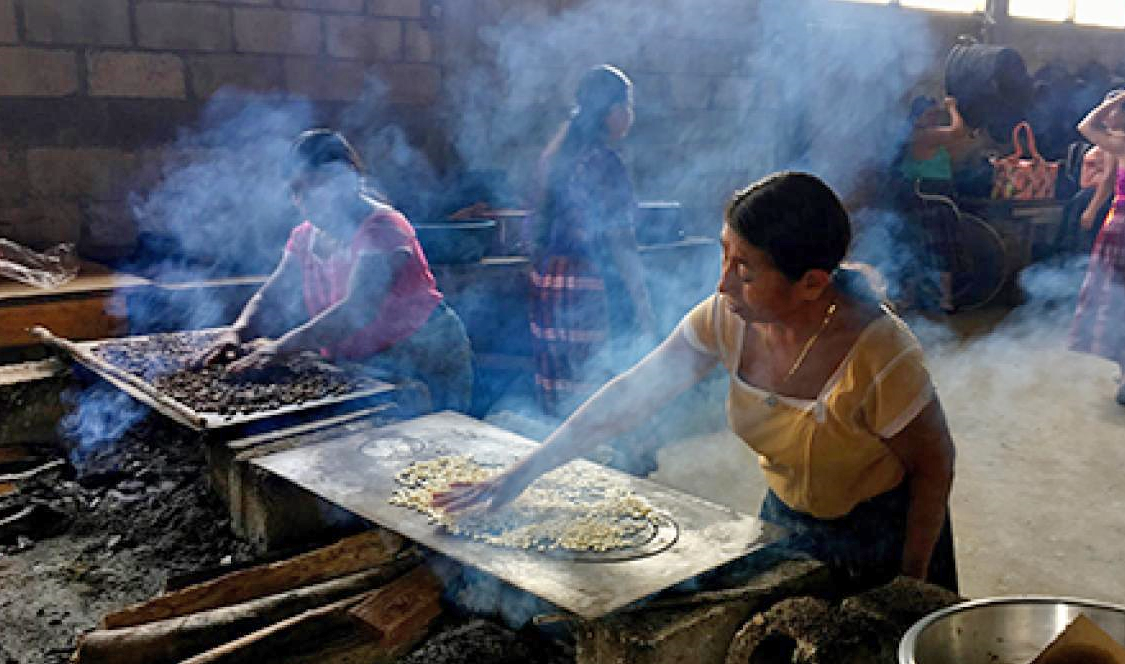 Chocolate makers in Guatemala treat cacao beans as they are prepared to use to make chocolate.