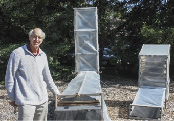 UC researcher Michael Reid developed this passive solar drier that can be used to dry such crops as tomatoes and leafy vegetables without electricity. (photo: Bob Johnson)