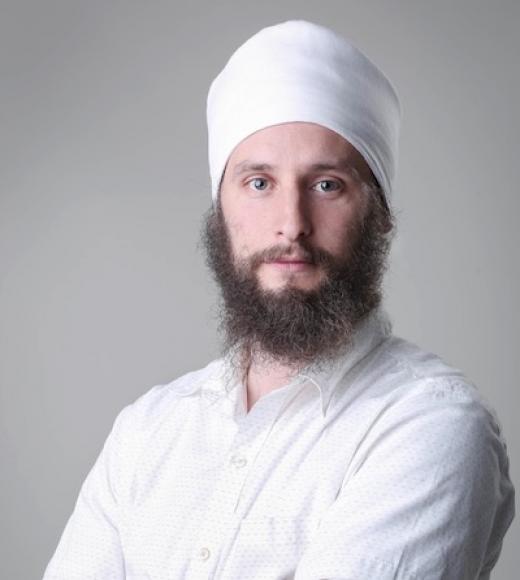 Man in white poses for camera.