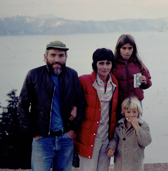 A family standing by water.