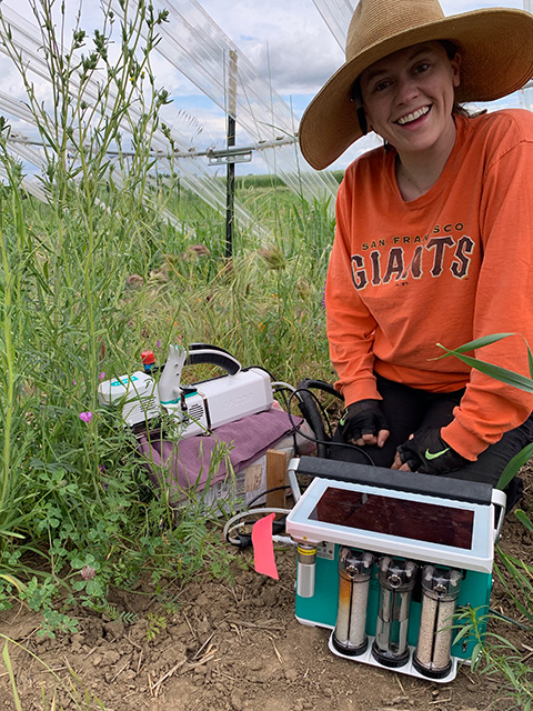 Young woman in a field with what looks like