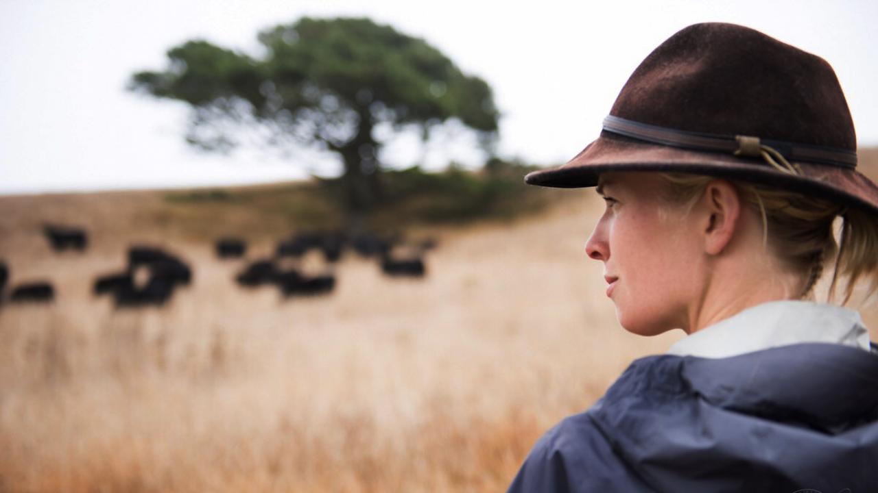 Female rancher in field
