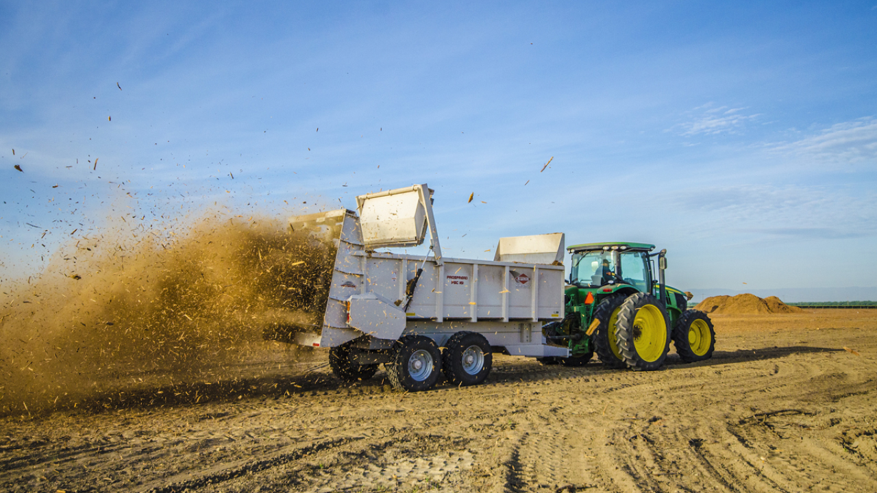 Wood chips from recycled almond trees are spread across an orchard in California's Stanislaus County. (photo Brent Holtz, UCANR)