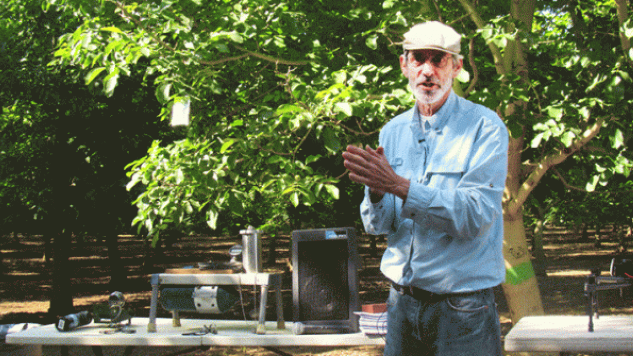 Ken Shackel, University of California, Davis, plant scientist, discusses pressure bombs during an irrigation field day in a walnut orchard near Red Bluff, Calif. (photo: Western Farm Press)