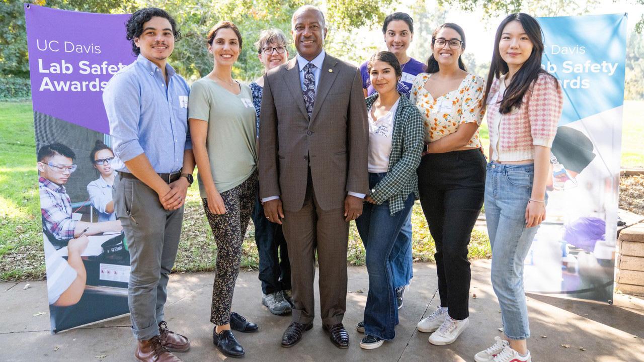 Seven people smiling