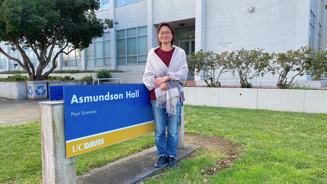 Woman smiles in front of Asmundson