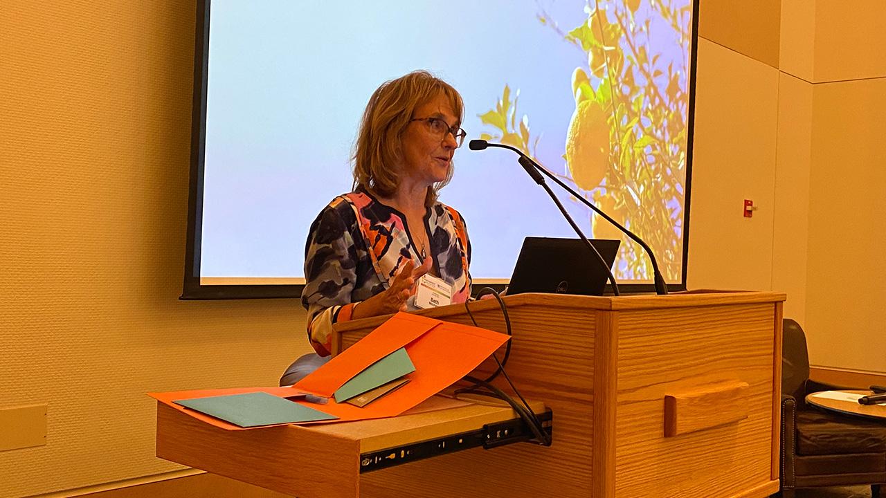 Woman speaking at a podium