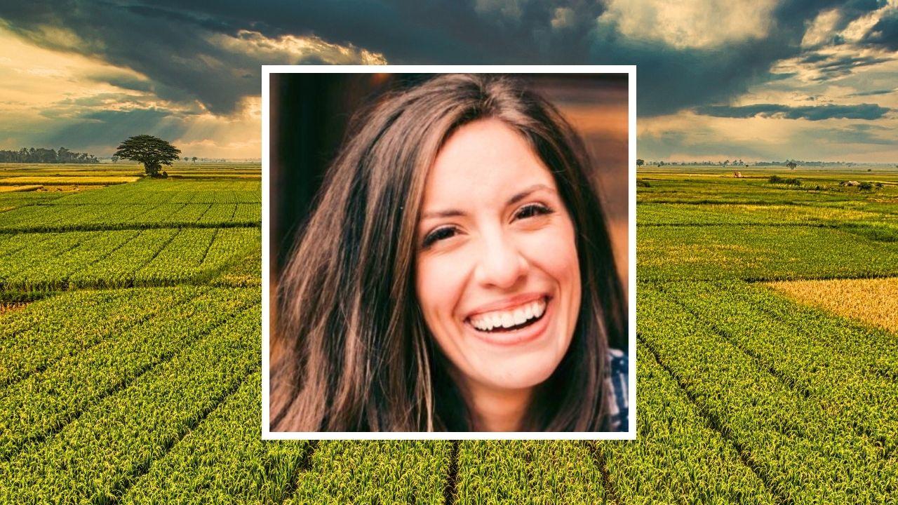 Women's headshot over field