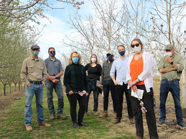 Provost Mary Croughan being shown around the orchard at UC Davis and meeting the Chancellor to talk engineering meets indoor ag in the celebration of $1B of UC Davis external funding to the campus, 2022