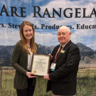 Grace Woodmansee (left), UC Davis graduate student, receives national leadership award from Professor Clayton Marlow, president of the Society for Range Management.