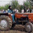 Farmer on tractor in Pakistan