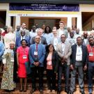 A large group of men and women in front of a building; above them reads "African Plant Breeding Academy CRISPR Course 1, January 2023"