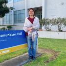 Woman smiles in front of Asmundson