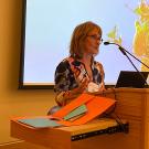 Woman speaking at a podium