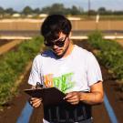 Christian Silva, fourth-year Ph.D. candidate in the Blanco Lab, in a tomato field